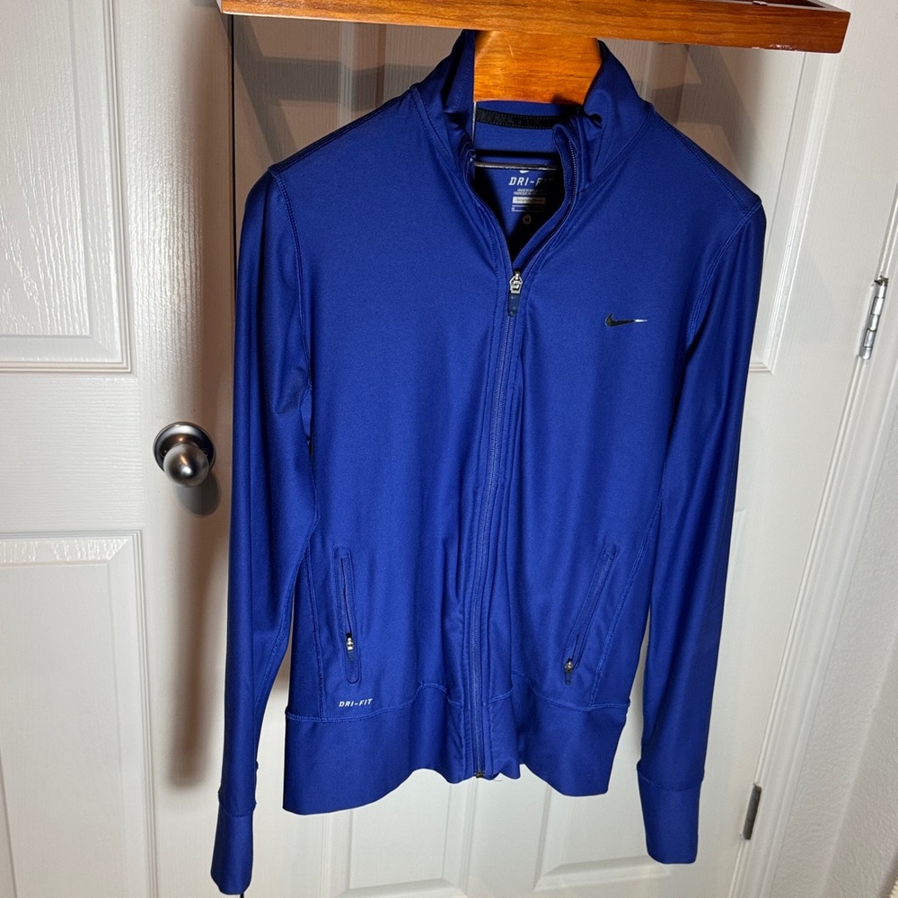Nike Dri-Fit women’s Royal Blue Performance Jacket full zip up.